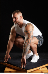 Whole Body Man White Sports Shorts Muscular Kneeling Top Studio photo references